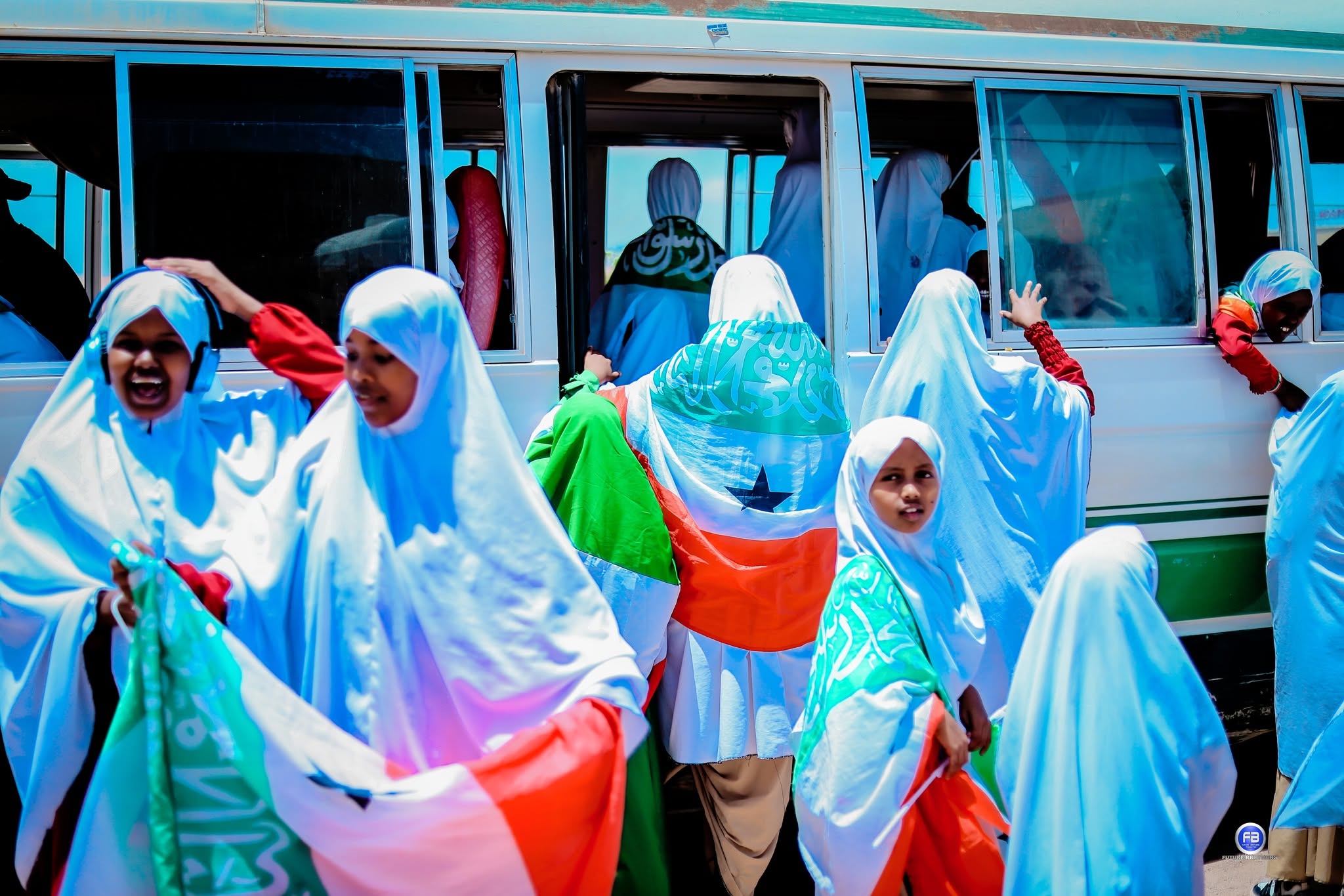 Girls boarding the Tabantaabo school bus